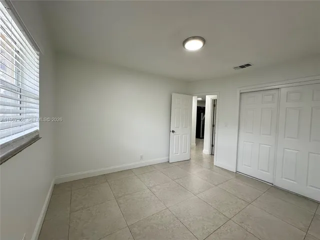 an empty room with a bathroom