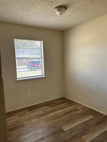 a view of a livingroom with wooden floor