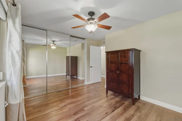 a bathroom with a granite countertop sink toilet tub and shower