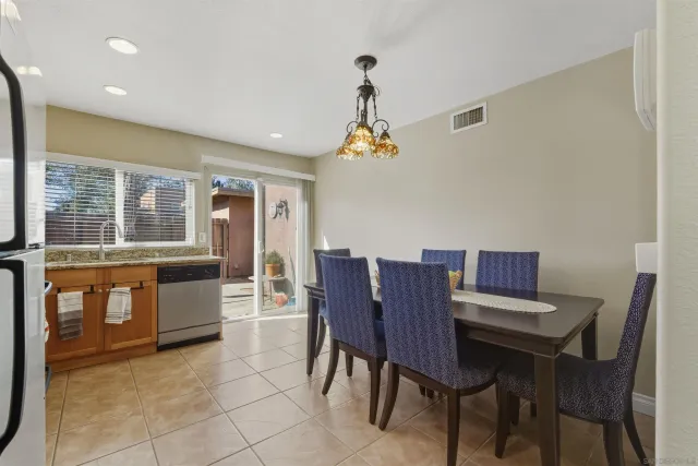 a living room with furniture fireplace and a large window