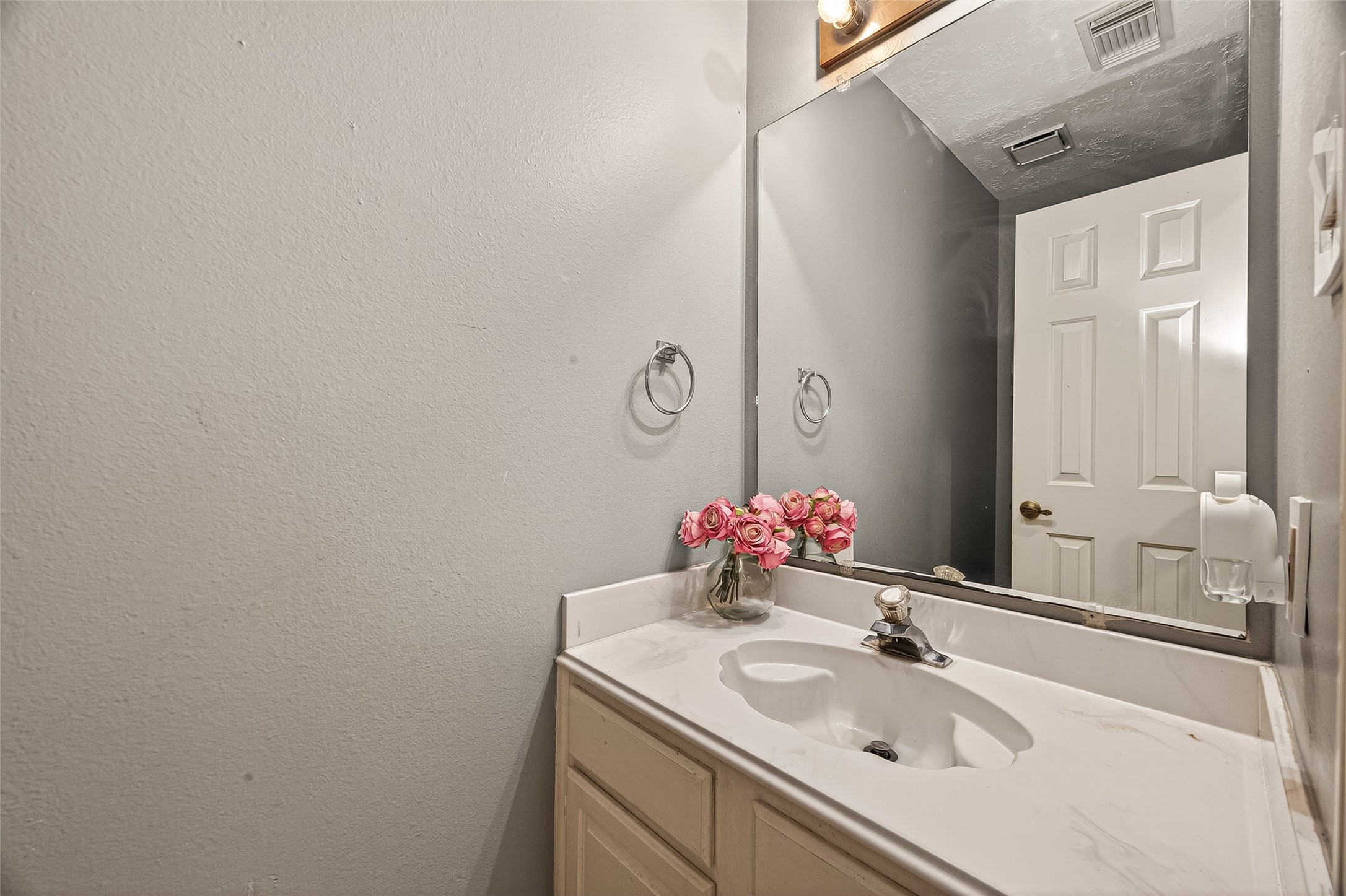 12206 Paddock Way Houston, TX 77065 - Photo 20 of 44 a bathroom with a sink and a mirror