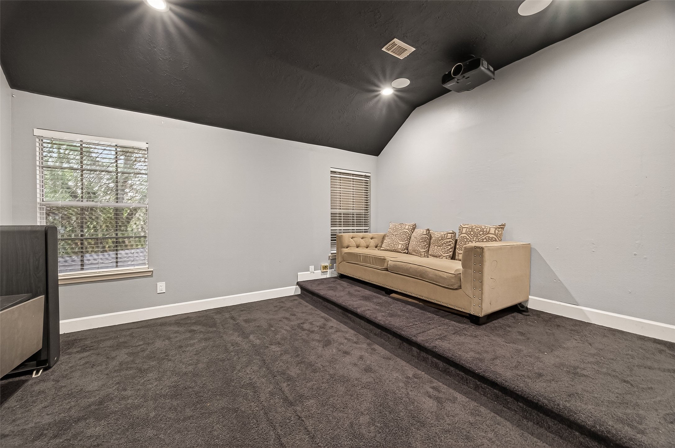 12206 Paddock Way Houston, TX 77065 - Photo 21 of 44 a living room with furniture and a flat screen tv
