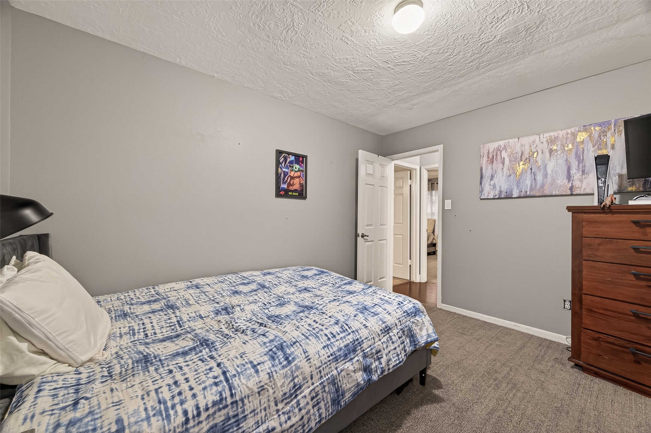 12206 Paddock Way Houston, TX 77065 - Photo 24 of 44 a bedroom with a bed and a window