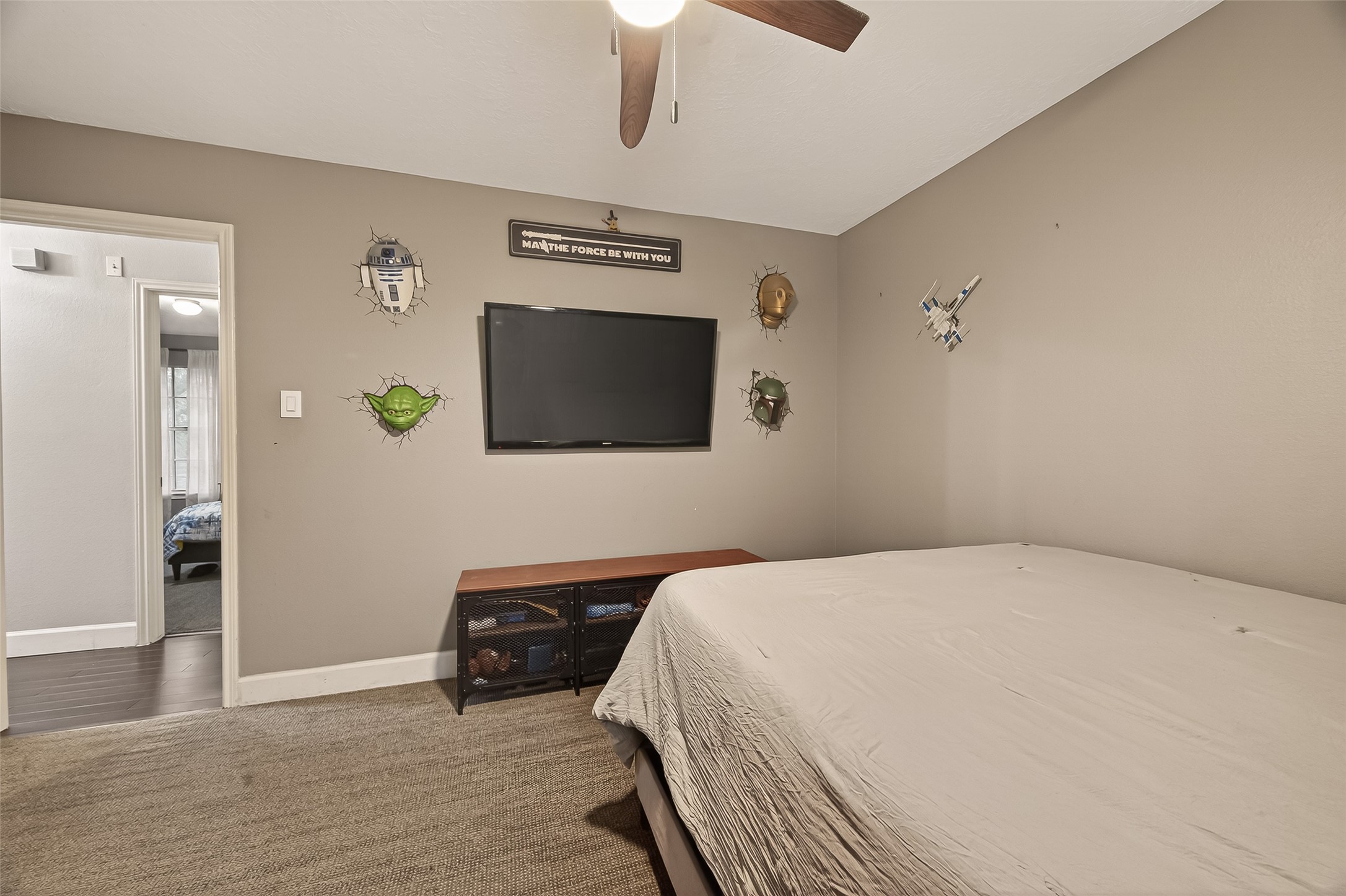 12206 Paddock Way Houston, TX 77065 - Photo 31 of 44 a bedroom with a bed and a flat screen tv