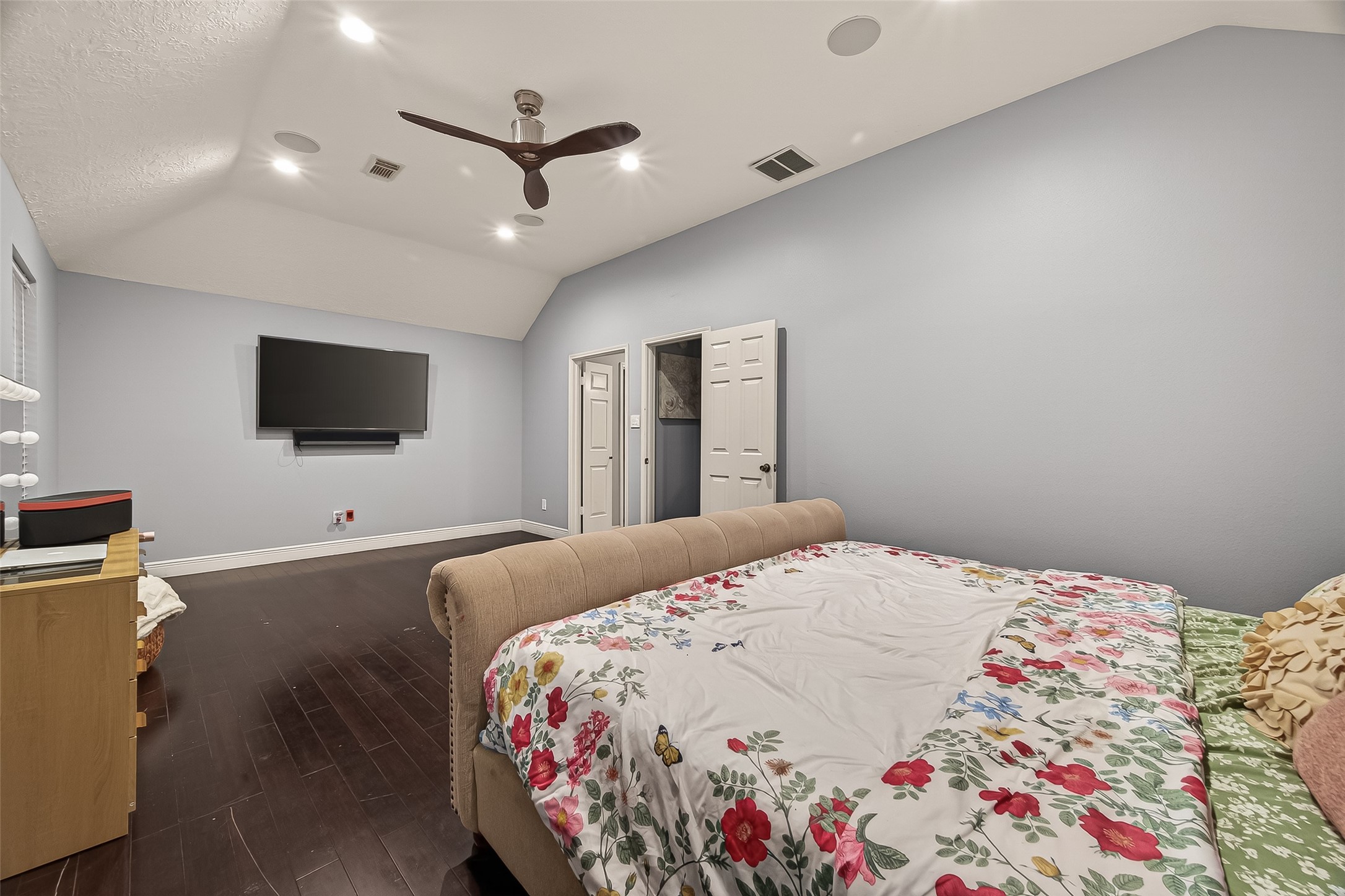 12206 Paddock Way Houston, TX 77065 - Photo 35 of 44 a bedroom with a bed and a flat screen tv