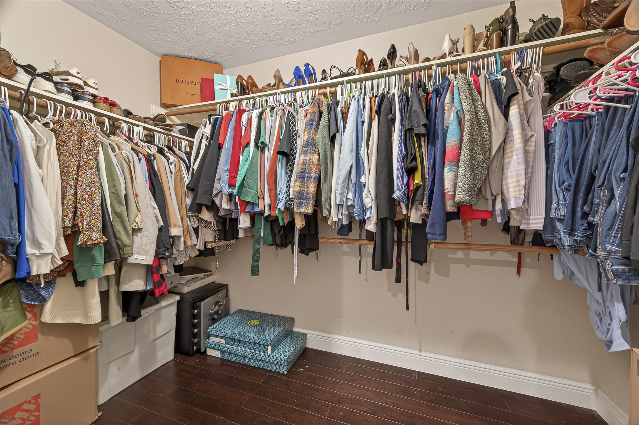 12206 Paddock Way Houston, TX 77065 - Photo 40 of 44 a view of walk in closet with clothes and shoes