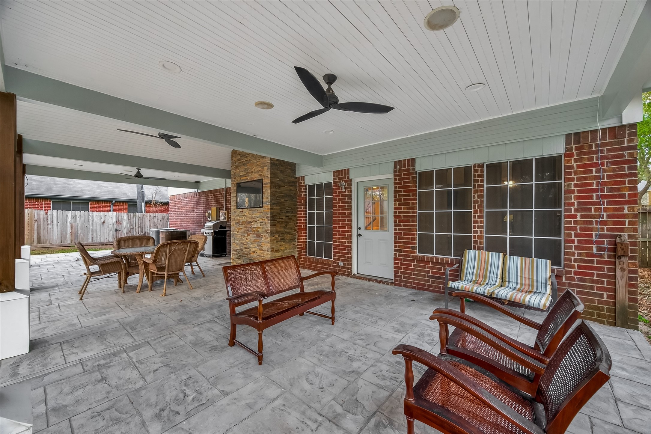 12206 Paddock Way Houston, TX 77065 - Photo 42 of 44 a building outdoor space with patio furniture