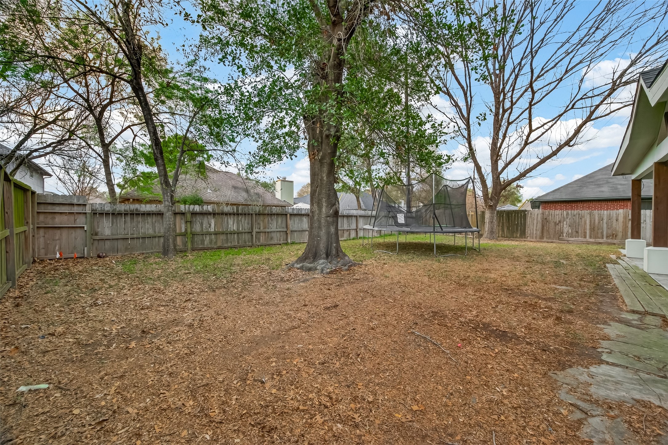 12206 Paddock Way Houston, TX 77065 - Photo 43 of 44 a view of a house with a yard
