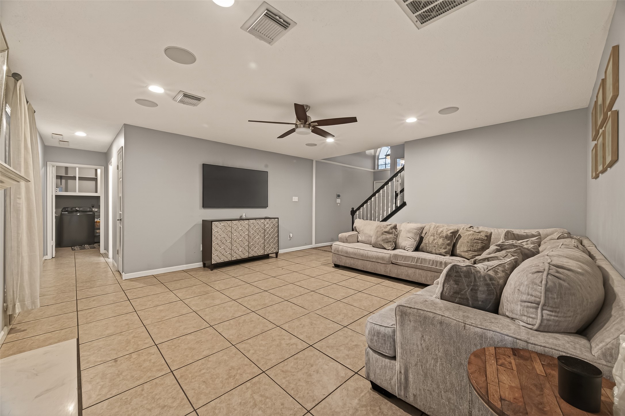 12206 Paddock Way Houston, TX 77065 - Photo 7 of 44 a living room with furniture and a ceiling fan