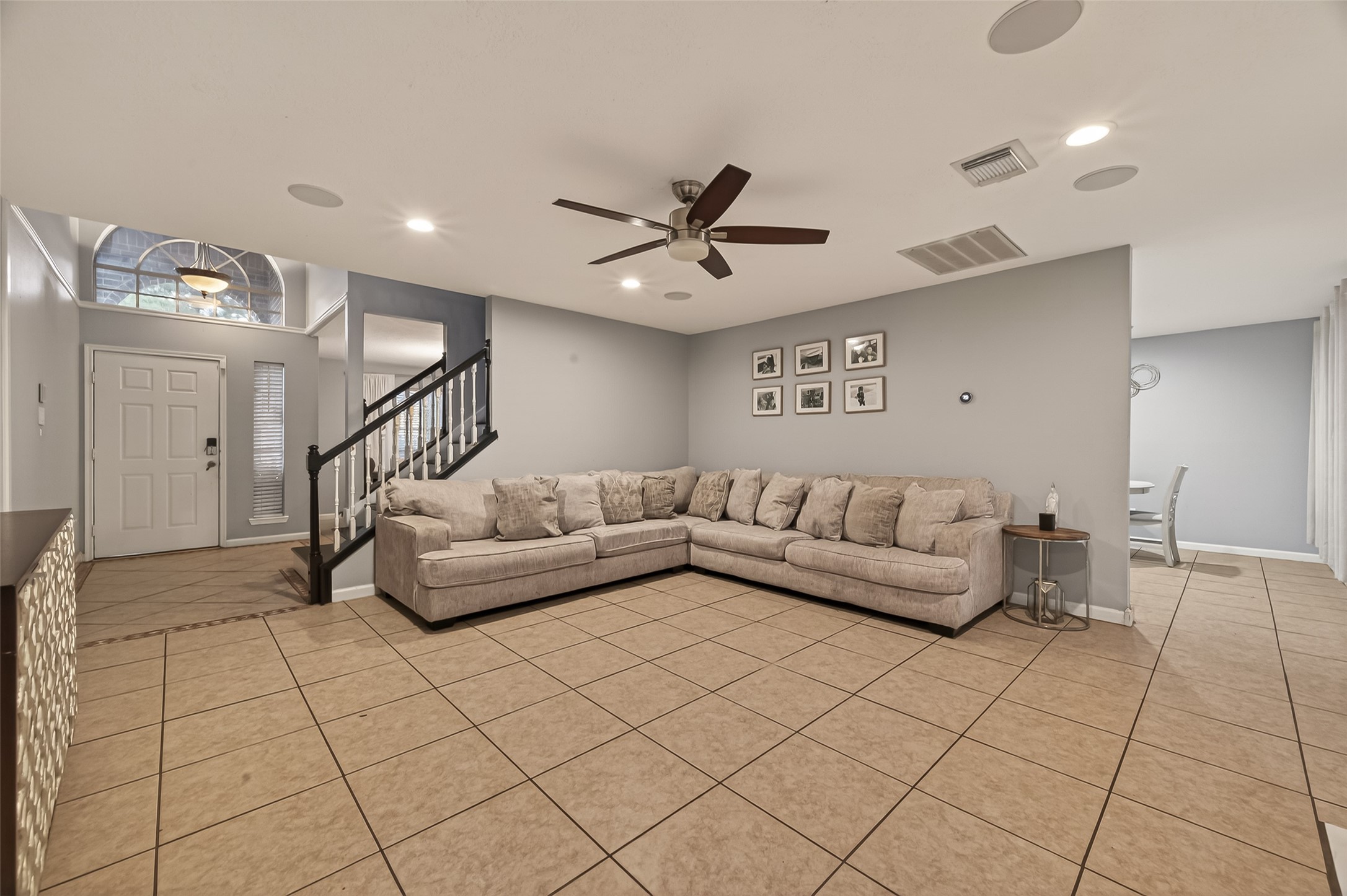 12206 Paddock Way Houston, TX 77065 - Photo 8 of 44 a living room with furniture and a ceiling fan