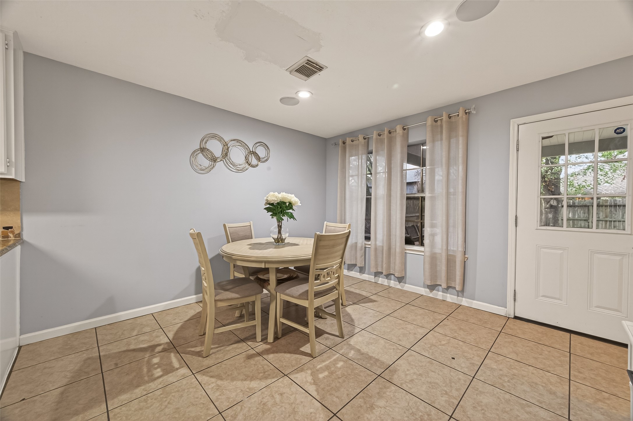12206 Paddock Way Houston, TX 77065 - Photo 9 of 44 a dining room with furniture and window