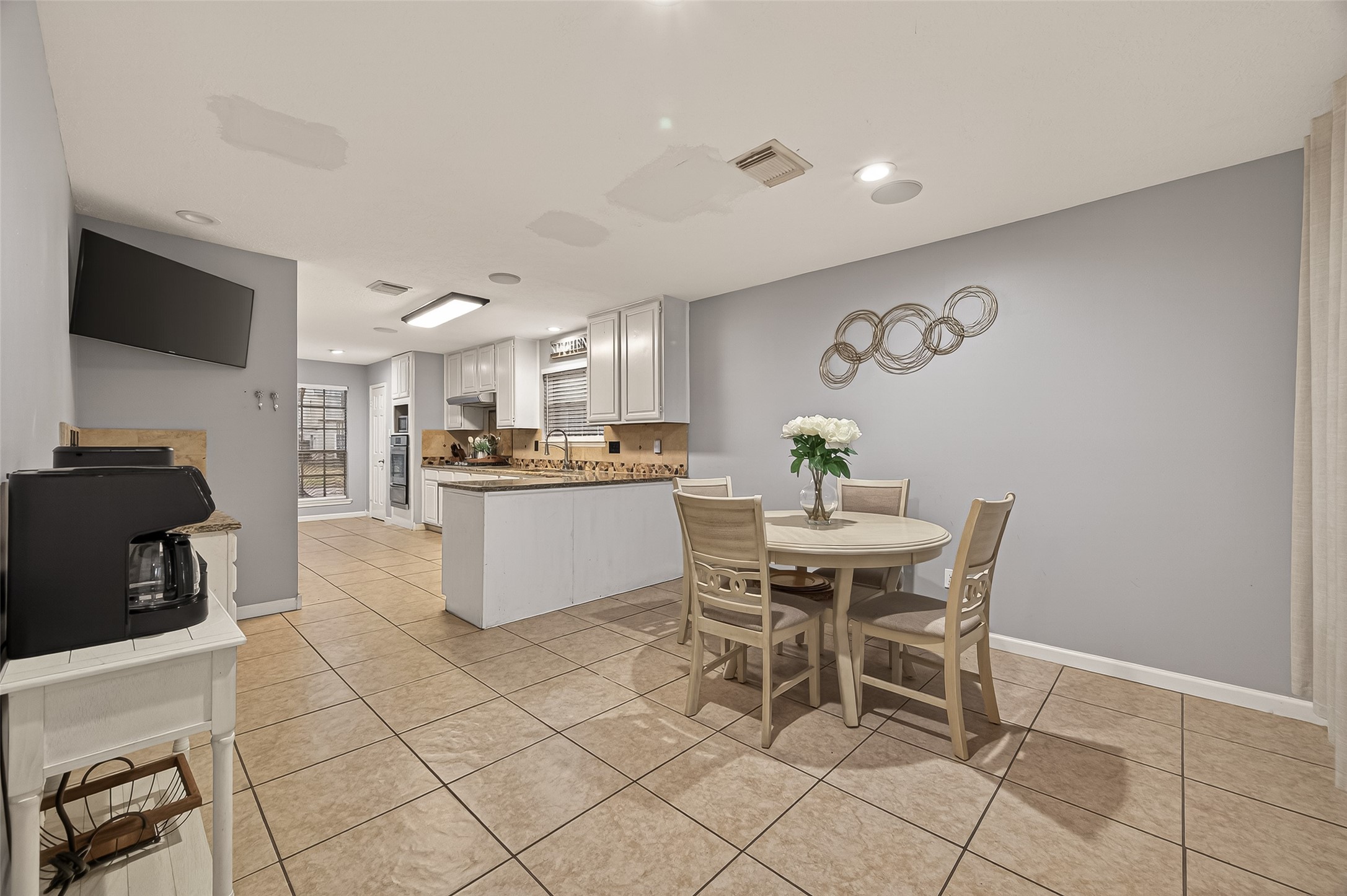 12206 Paddock Way Houston, TX 77065 - Photo 10 of 44 a view of a dining room with furniture