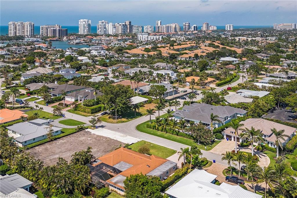 Undisclosed Address Naples, FL 34103 - Photo 4 of 6 an aerial view of residential houses with city view