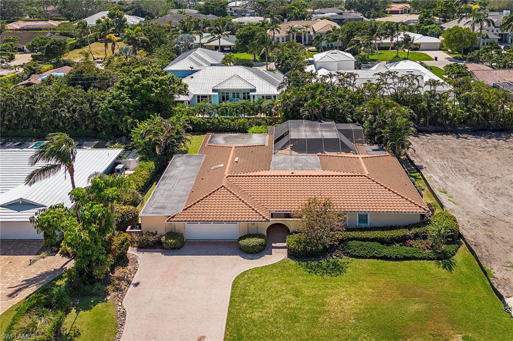Undisclosed Address Naples, FL 34103 - Photo 5 of 6 an aerial view of a house