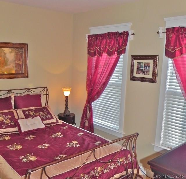 7810 Knox Ridge Road Huntersville, NC 28078 - Photo 13 of 18 a bedroom with a bed and wooden floor