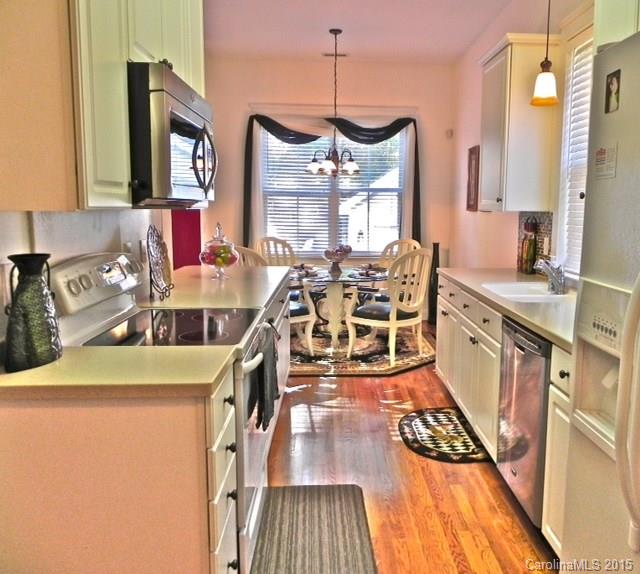 7810 Knox Ridge Road Huntersville, NC 28078 - Photo 8 of 18 a view of a kitchen with stove and wooden floor
