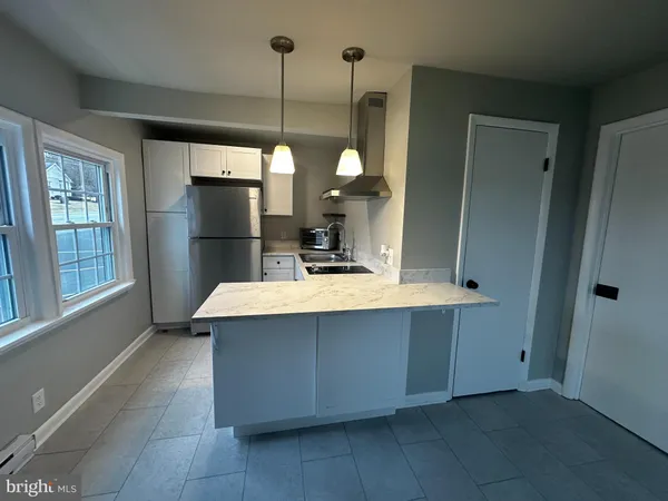 a kitchen with a stove and a microwave