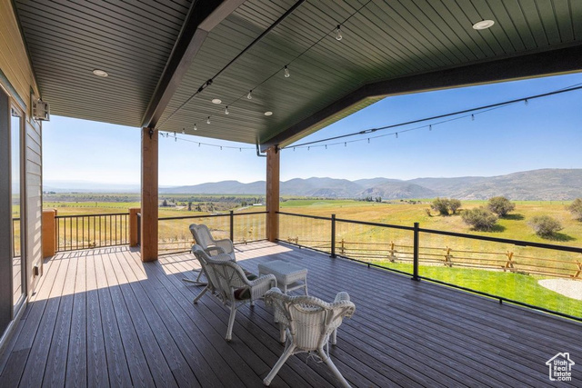 6117 North Rocky Ridge Road Peoa, UT 84061 - Photo 25 of 83 Wooden terrace featuring a rural view and a mountain view