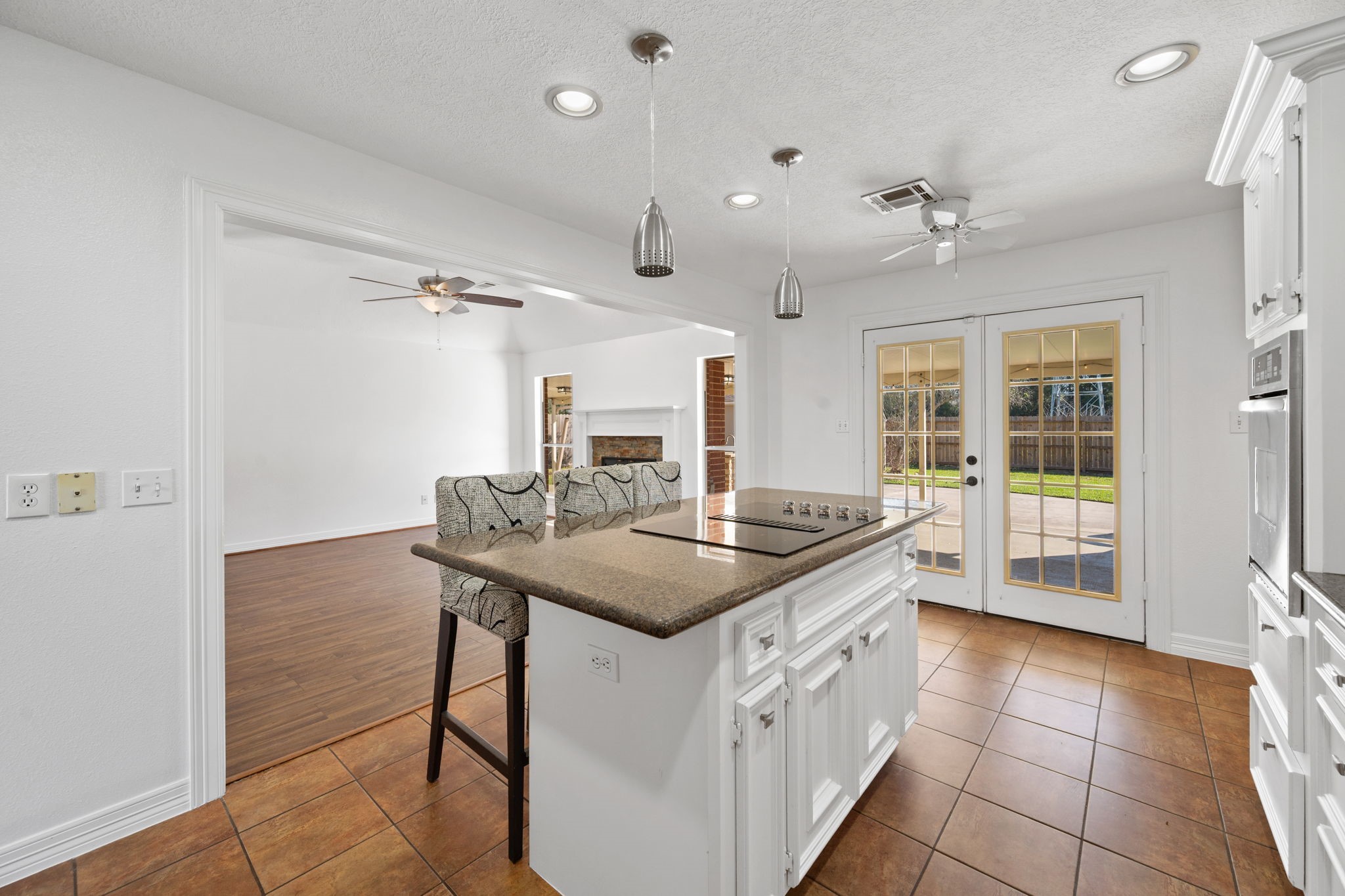 7302 Maple Lane Baytown, TX 77521 - Photo 9 of 24 Patio Doors Lead to Covered Outdoor Kitchen