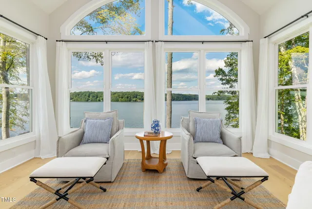 a living room with furniture a fireplace and a table