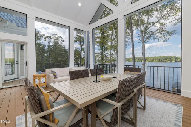 a dining room with a sink a dining table and chairs
