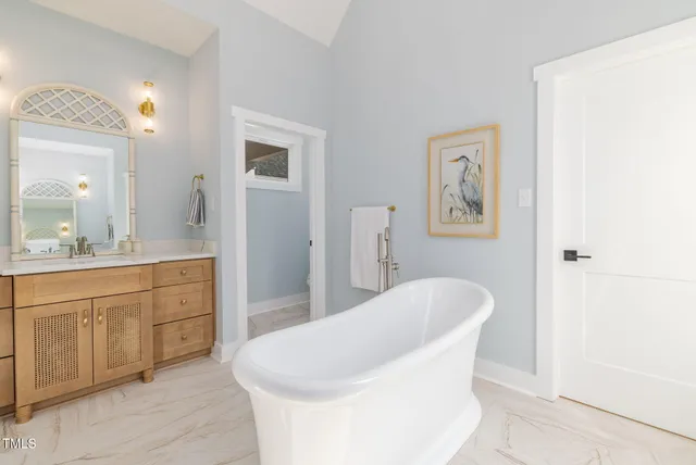 a bathroom with a shower and a sink