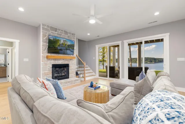 a view of a patio with couches plants and garden