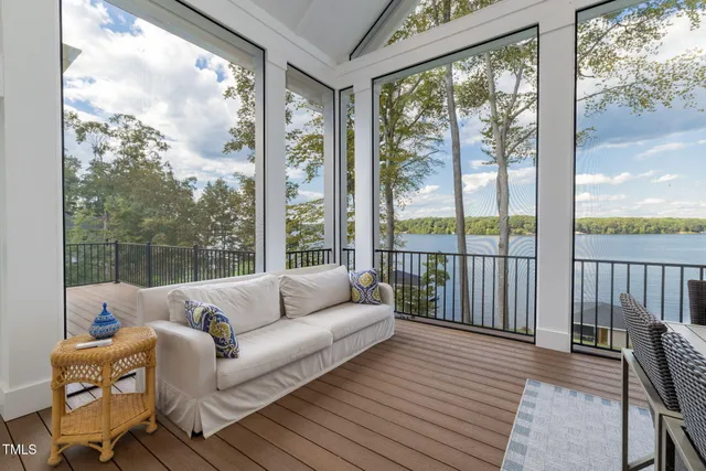 a living room with a large window and front door