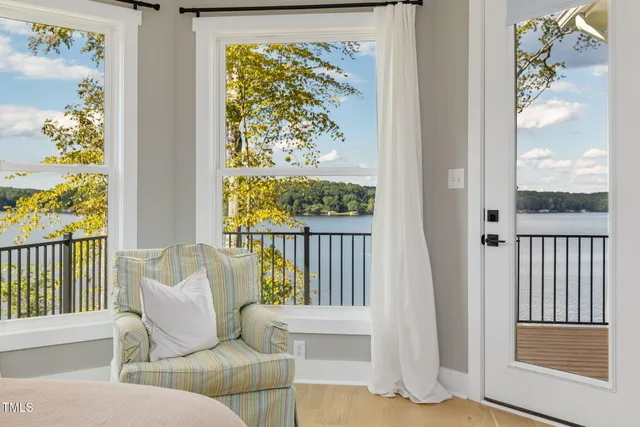 a bedroom with a bed and a lamp on table