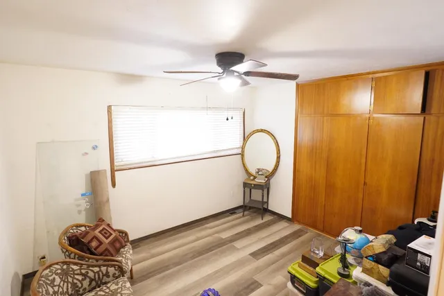 a room with a table and a chandelier