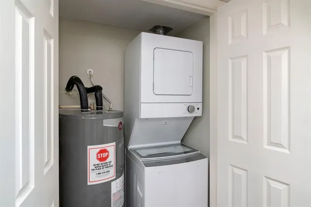 a utility room with closet dryer and washer