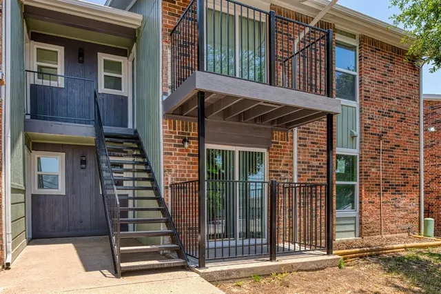 a view of a house with a door and wooden floor