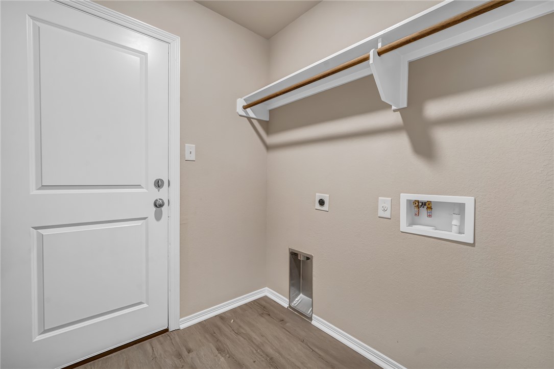 1218 High Street Navasota, TX 77868 - Photo 13 of 16 a view of a hallway with wooden floor