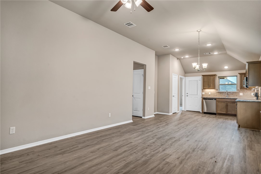 1218 High Street Navasota, TX 77868 - Photo 6 of 16 a view of a kitchen with a sink and a refrigerator