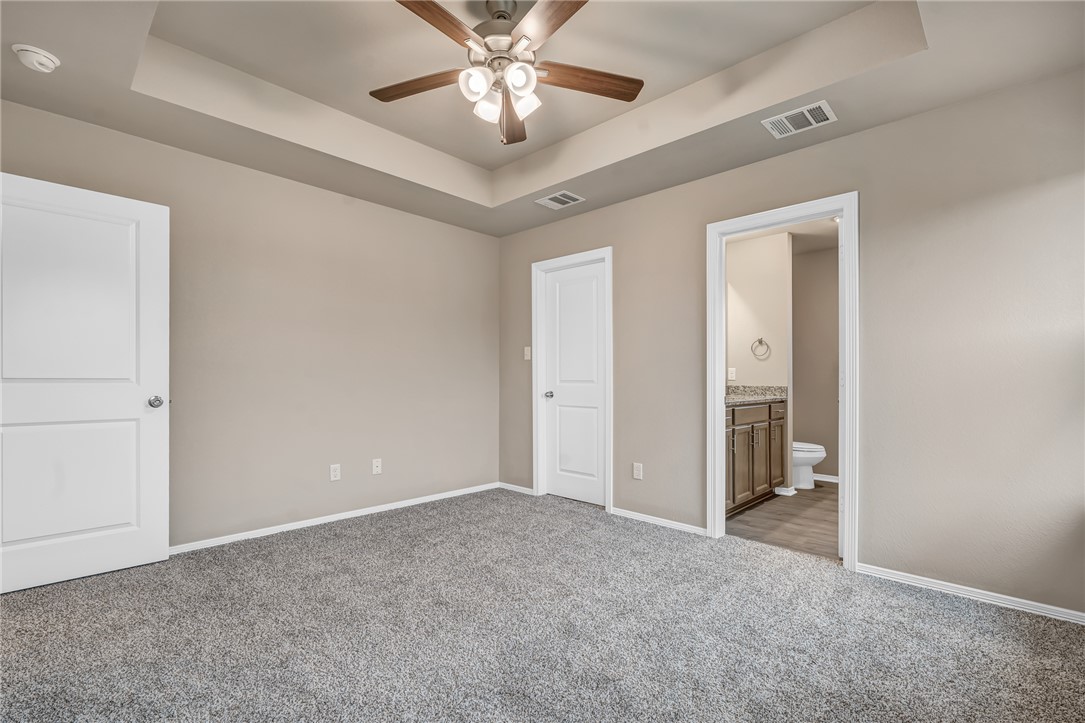 1218 High Street Navasota, TX 77868 - Photo 9 of 16 a view of an empty room and chandelier fan