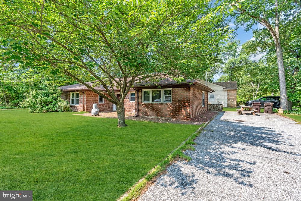 27 Litle Avenue Delran, NJ 08075 - Photo 1 of 20 a front view of a house with a garden