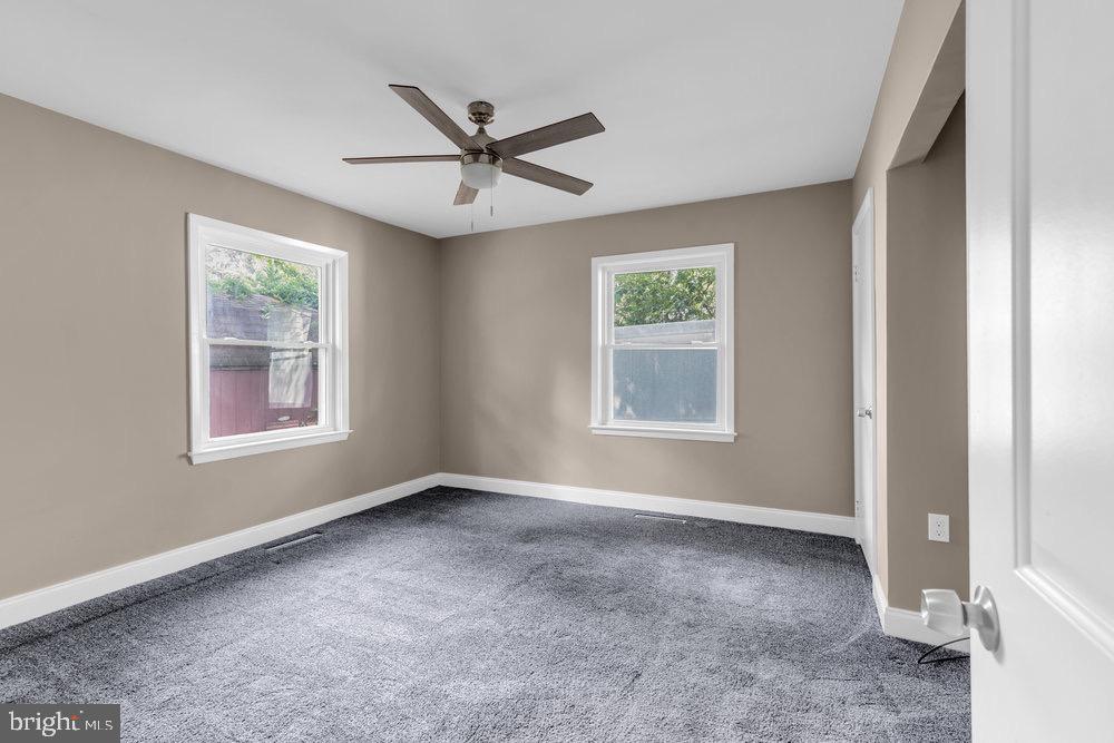 27 Litle Avenue Delran, NJ 08075 - Photo 17 of 20 a view of a big room with windows and chandelier fan