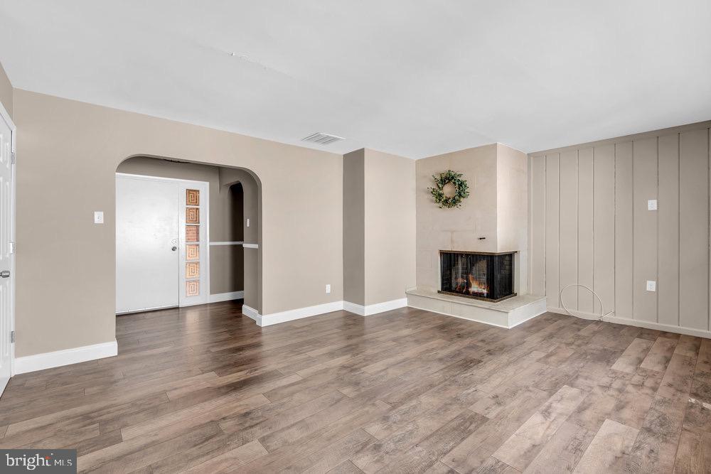 27 Litle Avenue Delran, NJ 08075 - Photo 4 of 20 an empty room with wooden floor fireplace and windows