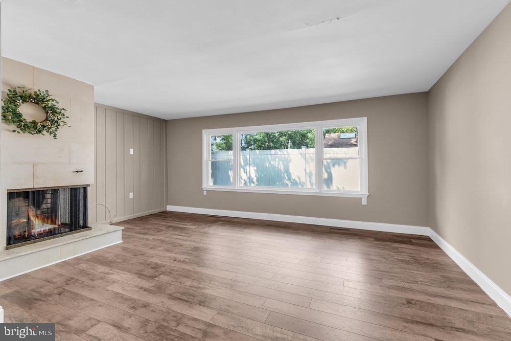 27 Litle Avenue Delran, NJ 08075 - Photo 5 of 20 a view of an empty room with a window and fireplace