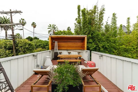 a view of a balcony with chairs