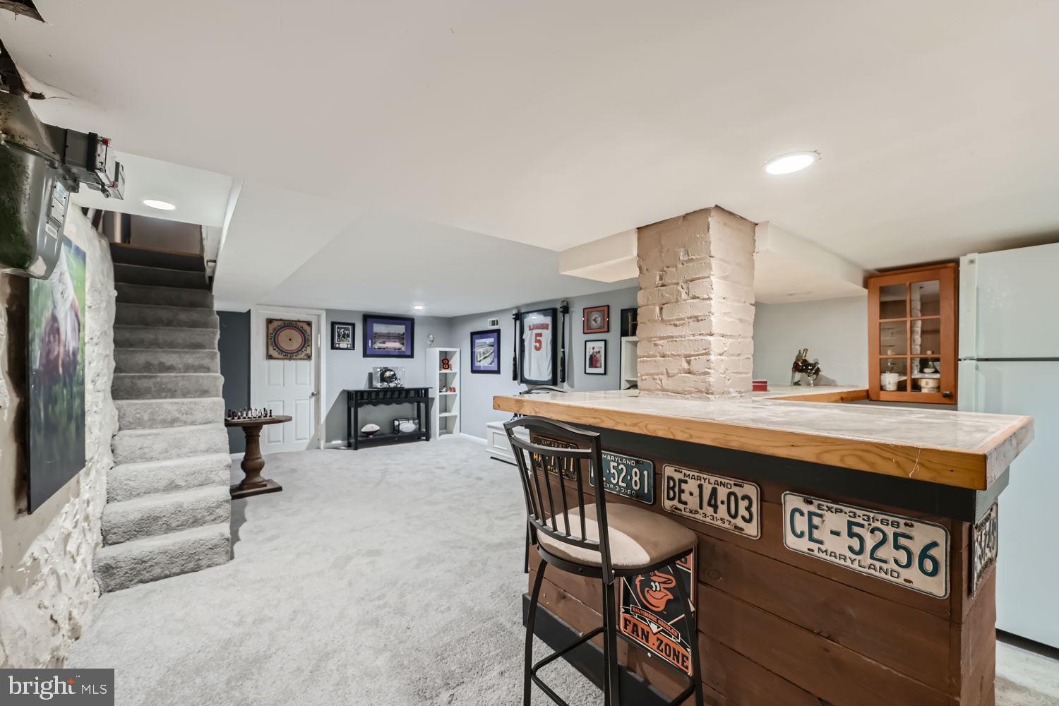 1215 West Old Cold Spring Lane Baltimore, MD 21211 - Photo 25 of 33 a view of a kitchen center island and living room