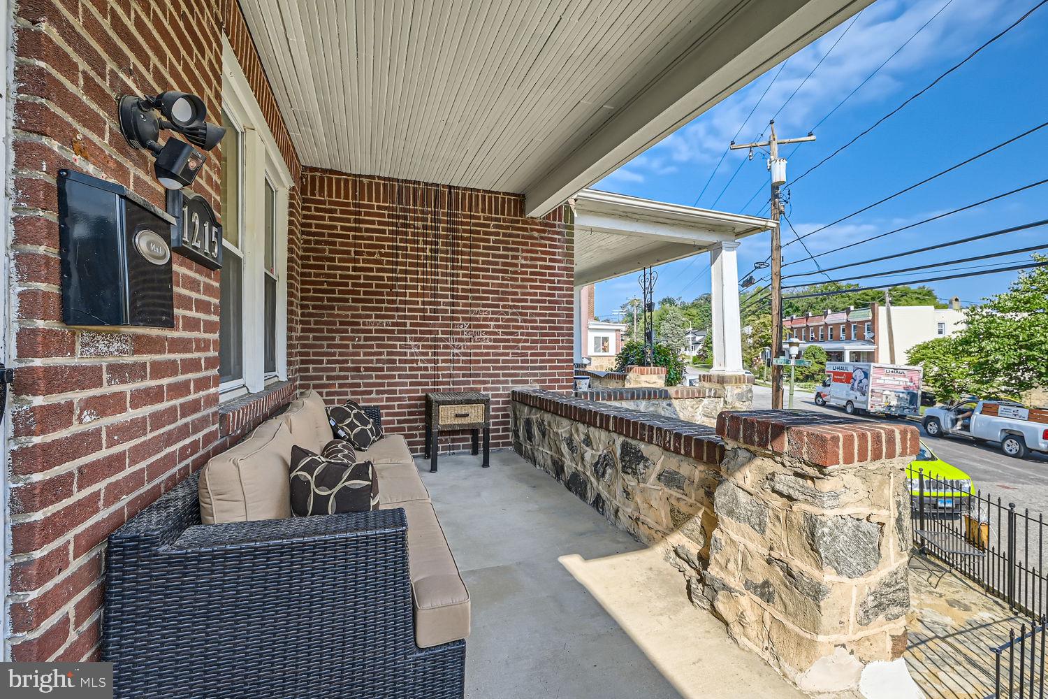 1215 West Old Cold Spring Lane Baltimore, MD 21211 - Photo 3 of 33 a balcony with furniture and a potted plant