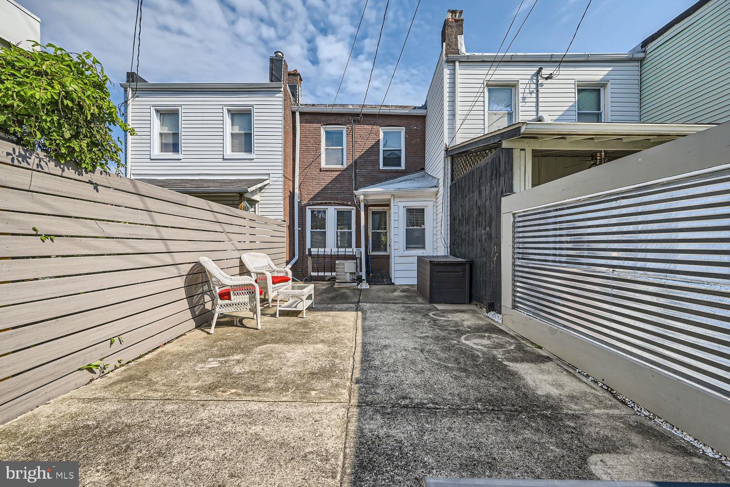 1215 West Old Cold Spring Lane Baltimore, MD 21211 - Photo 32 of 33 a view of a house with a patio