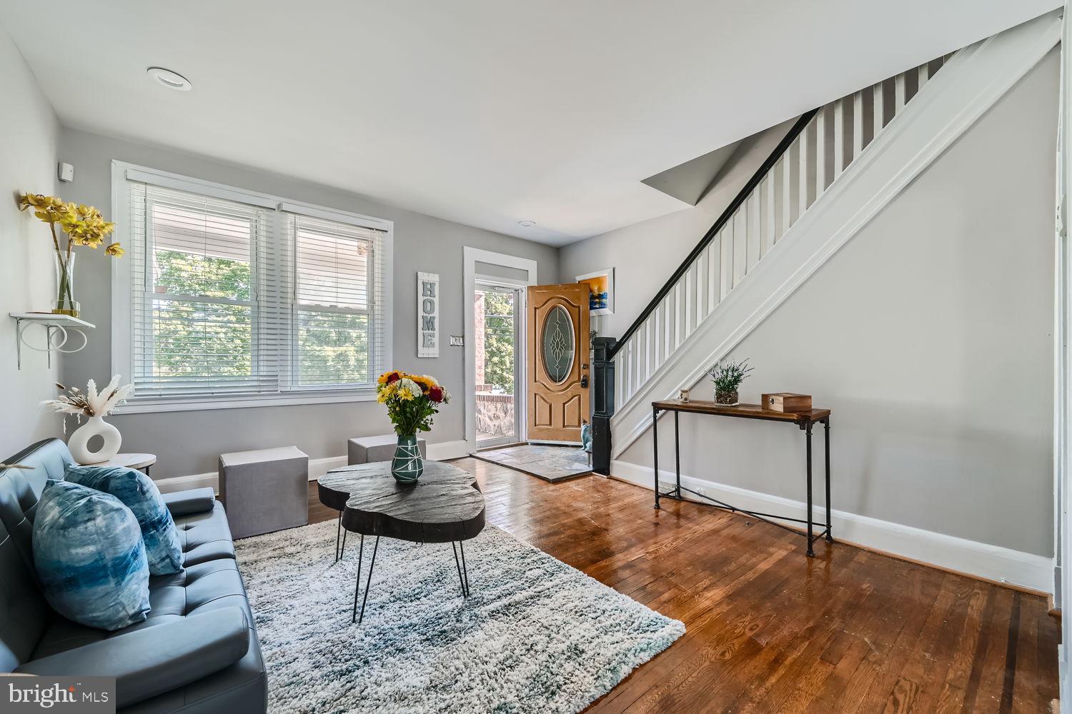 1215 West Old Cold Spring Lane Baltimore, MD 21211 - Photo 5 of 33 a living room with furniture and a wooden floor