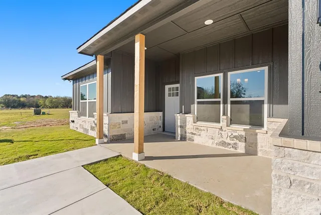 a front view of a house with lake view and living room