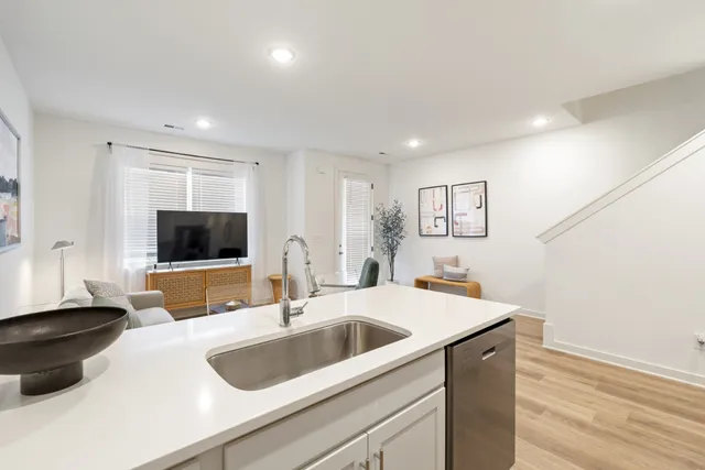 a kitchen with a sink and a refrigerator