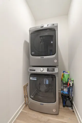 a stove top oven sitting inside of a kitchen