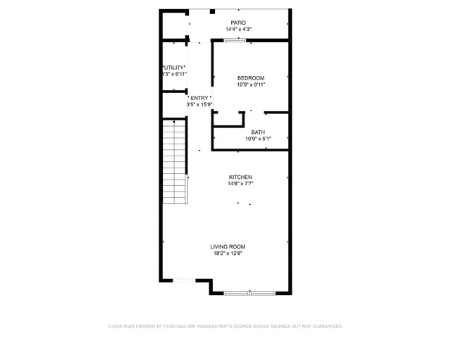 a picture of a bench in front of a wall