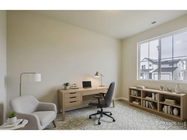 a workspace with furniture and window