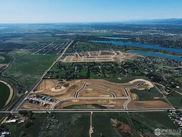 an aerial view of a residential houses with outdoor space